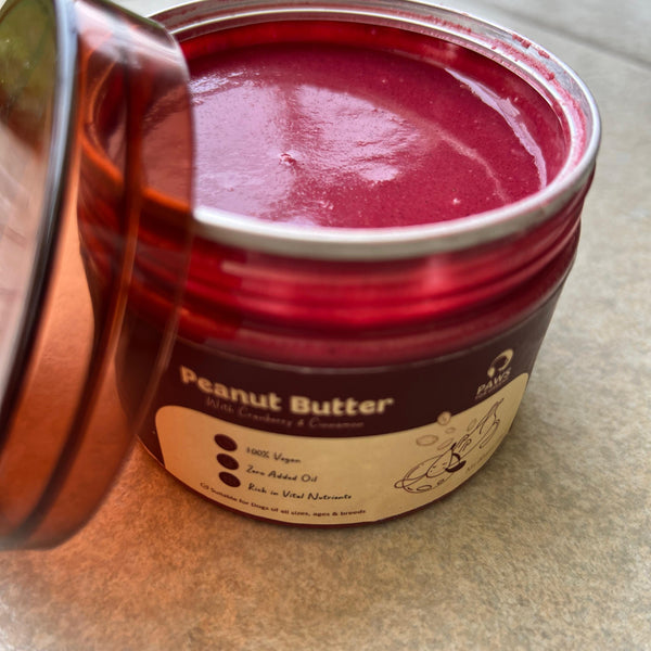 Creamy vegan peanut butter with cranberries, cinnamon rich in antioxidants and fibre; supports digestion and wellness; ideal for enrichment. - alternate view